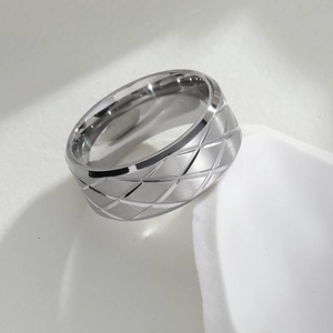 Minimalist silver geometric ring with engraved diamond pattern and brushed metal finish