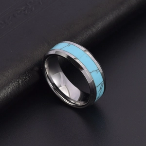 Titanium steel couple ring featuring turquoise inlay on a polished wide band surface