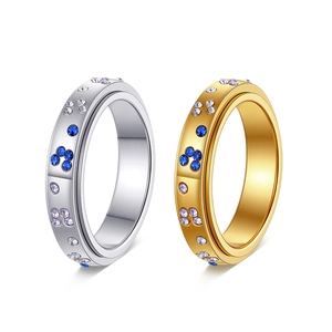 Rotating stainless steel rings for stress relief with blue and purple crystal butterflies