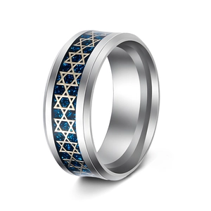 Macro view of men's titanium ring featuring gold hexagrams on a blue starry inlay