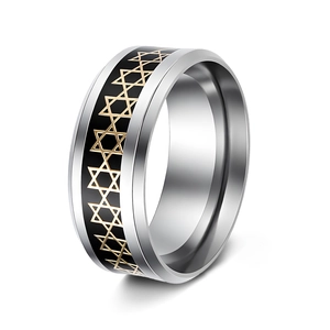 Close-up of vintage hollow hexagram star ring with gold and black geometric details