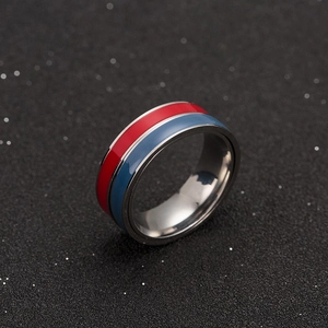 Detailed close-up of dual-tone red and blue enamel rotating stainless steel ring band
