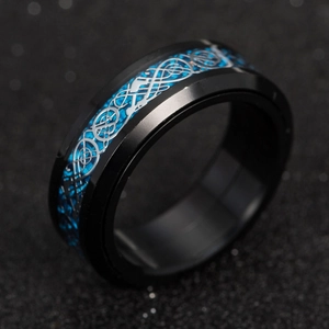 Detailed side view of black stainless steel ring with blue carbon fiber and silver dragon inlay