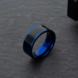 Polished blue titanium steel NFC smart ring with black rectangular inlay on a stone surface