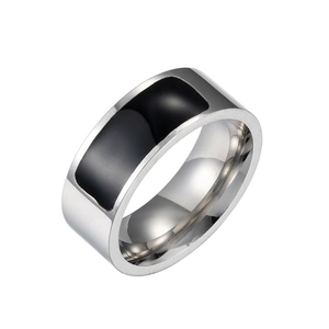 Detail of smart NFC ring featuring a wide band with silver and black enamel inlay design