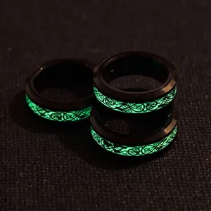 Luminous spinning dragon ring with green glow celtic knot pattern on black stainless steel