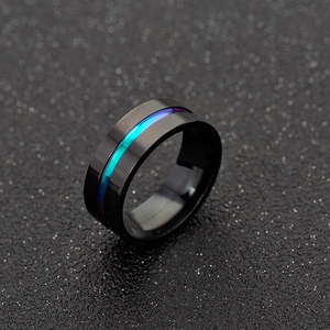 Minimalist black matte ring with a deep blue gradient groove on a dark textured background