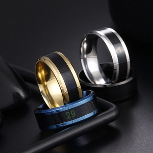 Smart temperature sensor rings in gold, silver, and blue finishes with digital thermal display