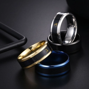 Macro shot of four temperature-sensitive stainless steel rings in assorted colors