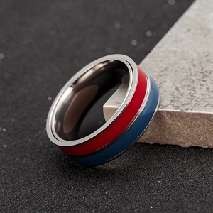 Modern two-tone rotatable spinner ring in blue and red finish with brushed steel interior