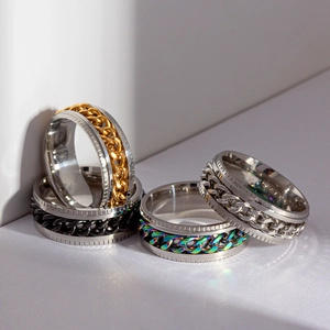 Titanium steel spinner rings with rotating cuban chains in silver, gold, and rainbow colors
