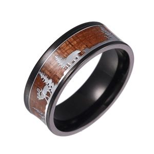 Men's wide titanium ring with wood inlay featuring laser-engraved forest deer pattern
