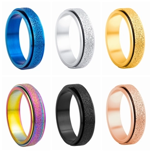 Frosted spinner rings for stress relief in six colors including rainbow and rose gold