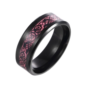 Close-up of black stainless steel ring with pink inlay and Celtic dragon pattern