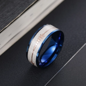 Detail of 8mm arrow pattern inlay on white texture ring with blue steel inner band