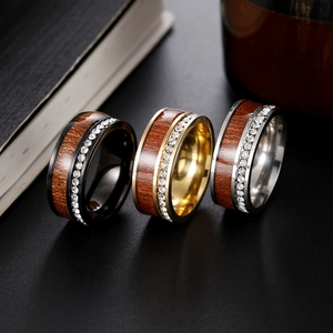 Three-color stainless steel rings with wood inlay and cubic zirconia in a trio set