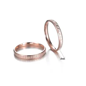 Polished rose gold titanium steel gear rings with 4mm width and grooved texture