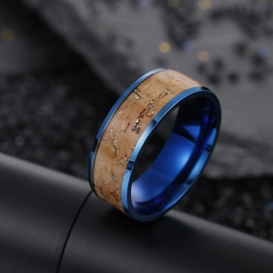 Macro shot of 8mm blue vintage ring featuring a textured wood grain inlay detail