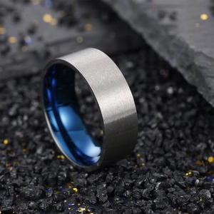 Two-tone matte grey brushed steel ring with electric blue polished inner surface