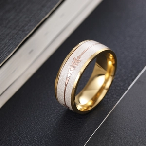 8mm gold titanium men's ring featuring white fiber inlay and rose gold arrow pattern