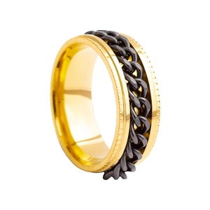 Close-up of black and gold rotating chain ring with industrial punk design details
