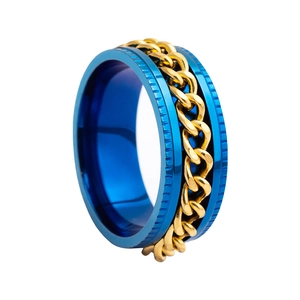 Macro shot of men's blue spinner ring with golden chain inlay and gear edges