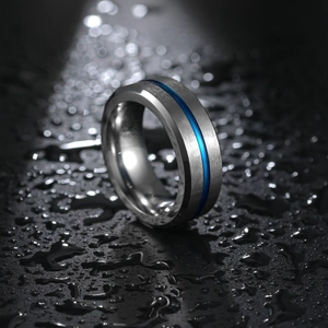 8mm brushed titanium steel ring for men with thin blue stripe inlay on water drops background