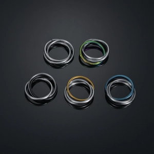 Close-up of triple interlocking stainless steel nose rings in five assorted metallic colors