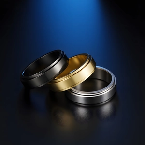 Polished titanium steel spinner rings for men in gold, black and silver finishes