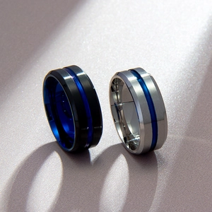 Detail of 8mm men's rings in matte black and silver with blue center grooves