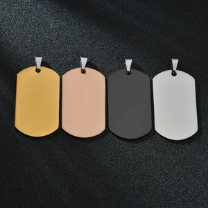 Detailed view of vacuum plated dog tags in gold, rose gold, black and silver finishes