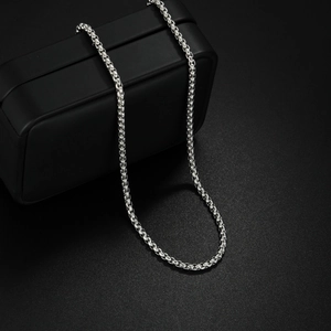 Detailed view of silver stainless steel box chain necklace with a polished metallic finish