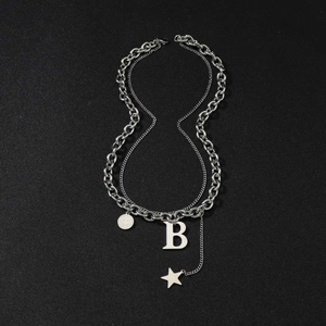 Double-layered silver titanium steel necklace featuring letter B and star pendants on black background