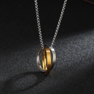 Minimalist interlocking Mobius ring necklace in silver and gold finish stainless steel