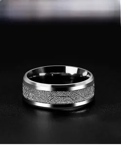 Macro shot of titanium steel men's ring with brushed texture and polished edges