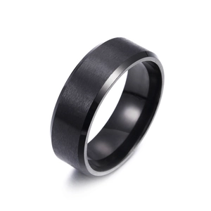 Detail of 8mm matte black stainless steel ring with brushed texture and beveled edges