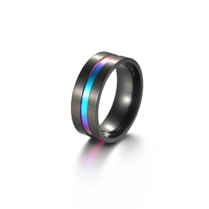 Macro detail of black stainless steel ring featuring a vibrant iridescent gradient inlay