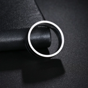8mm stainless steel ring with double black enamel grooves on a leather background