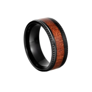 Detail of black titanium ring featuring acacia wood inlay and stepped gear edges