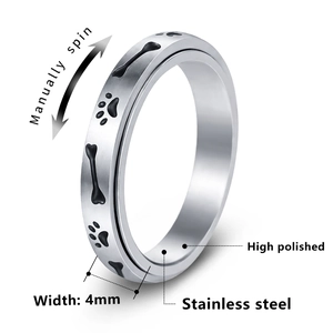 Polished 4mm stainless steel fidget ring with rotating black paw and bone patterns