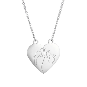 Detailed view of silver heart pendant featuring an engraved couple sketch for lovers
