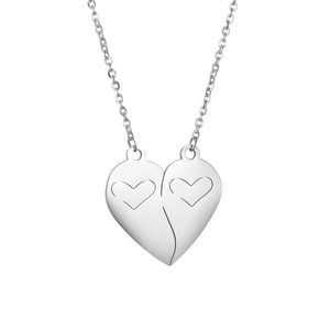 Detailed macro view of interlocking heart pendants on polished stainless steel chains