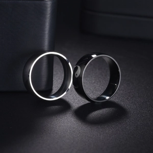 Detail of 8mm stainless steel rings featuring black Yin Yang laser engraving and silver finish
