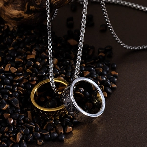 Viking Rune two-tone steel rings necklace on black stone background for men
