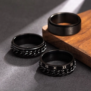 Three-piece black titanium spinner ring set for men with roman numerals and chain links