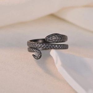Vintage stainless steel open snake ring with detailed scale texture in a wrapped design