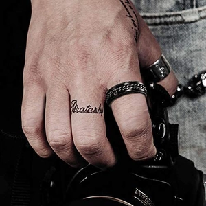 Men's punk style black spinner chain ring in stainless steel worn by a male model