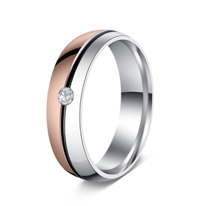 Macro detail of 6mm two-tone silver and rose gold steel ring with a small zircon stone