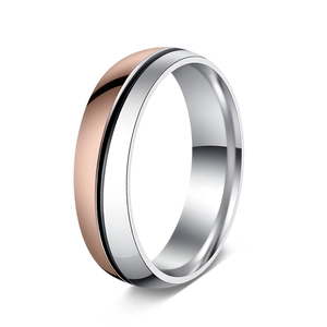 Detail of 6mm two-tone stainless steel ring with rose gold plating and black groove line