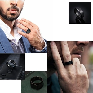 Macro details of men's black stainless steel rings with matte and polished finishes
